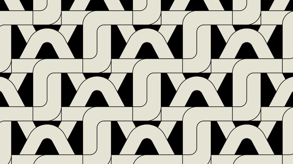 Overlapping tan Telnyx logos on a black background