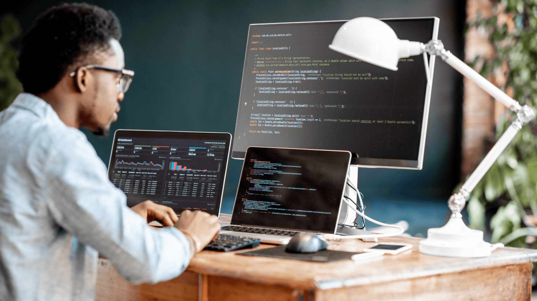 Man Programs on Multiple Screens