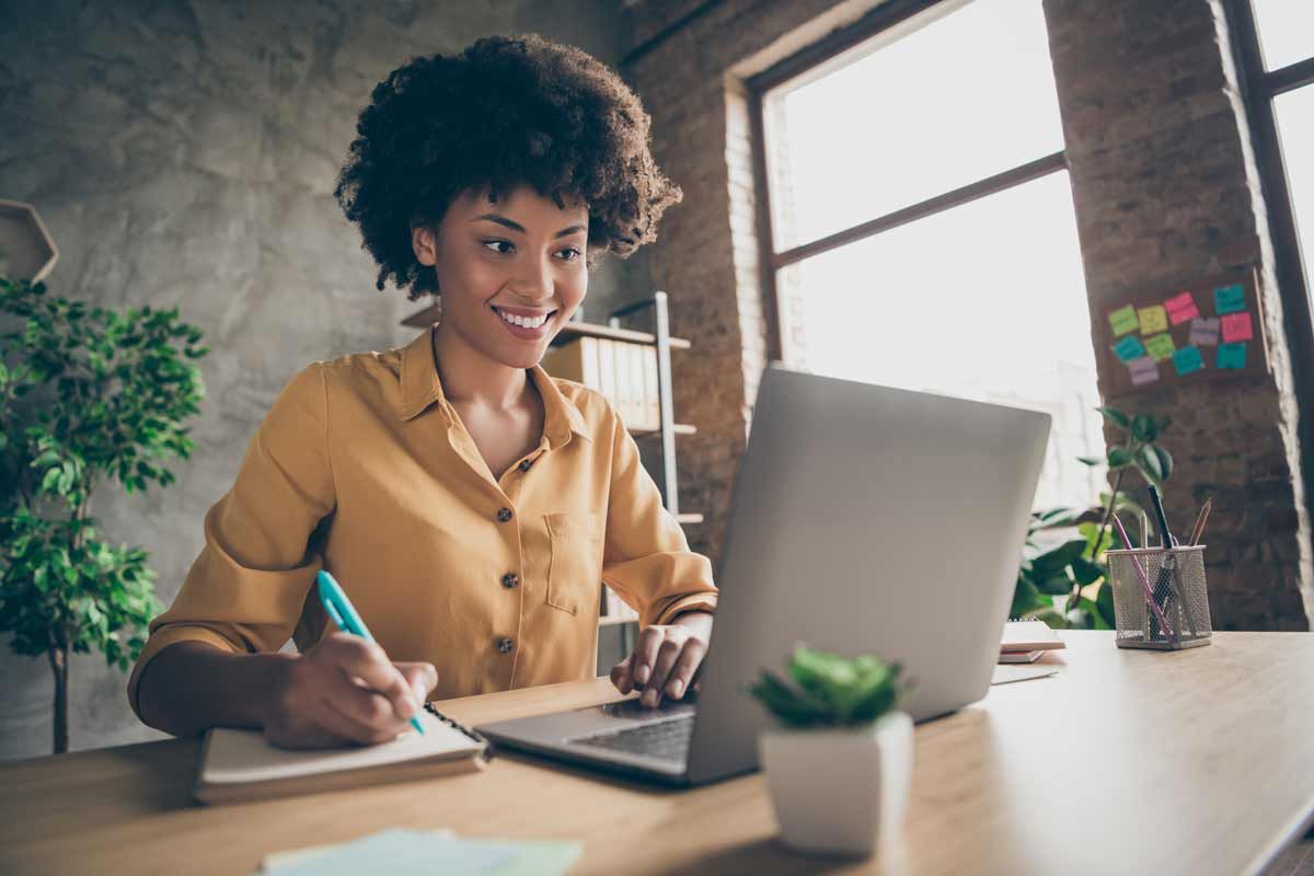 Woman with Afro takes notes