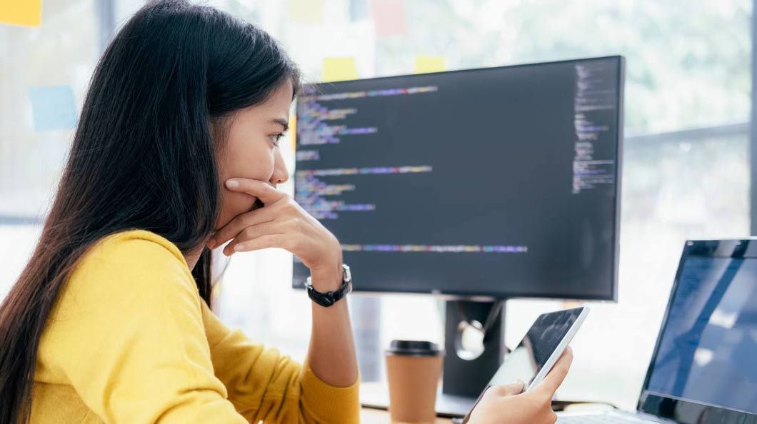 Woman building IVR app with Telnyx