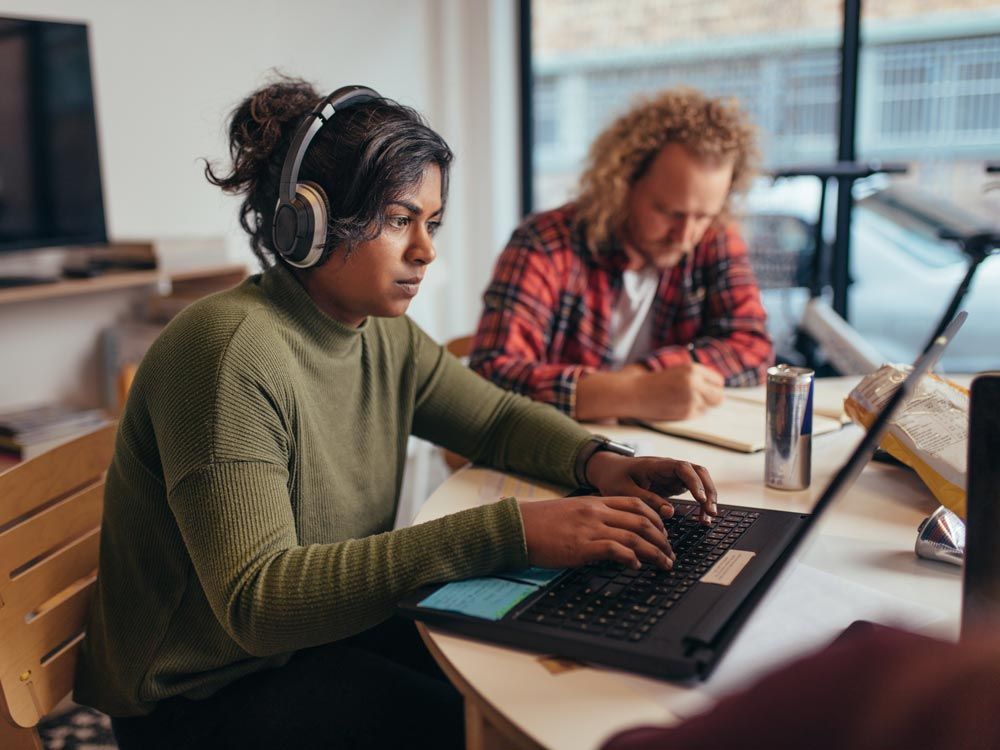 Woman in headphones working